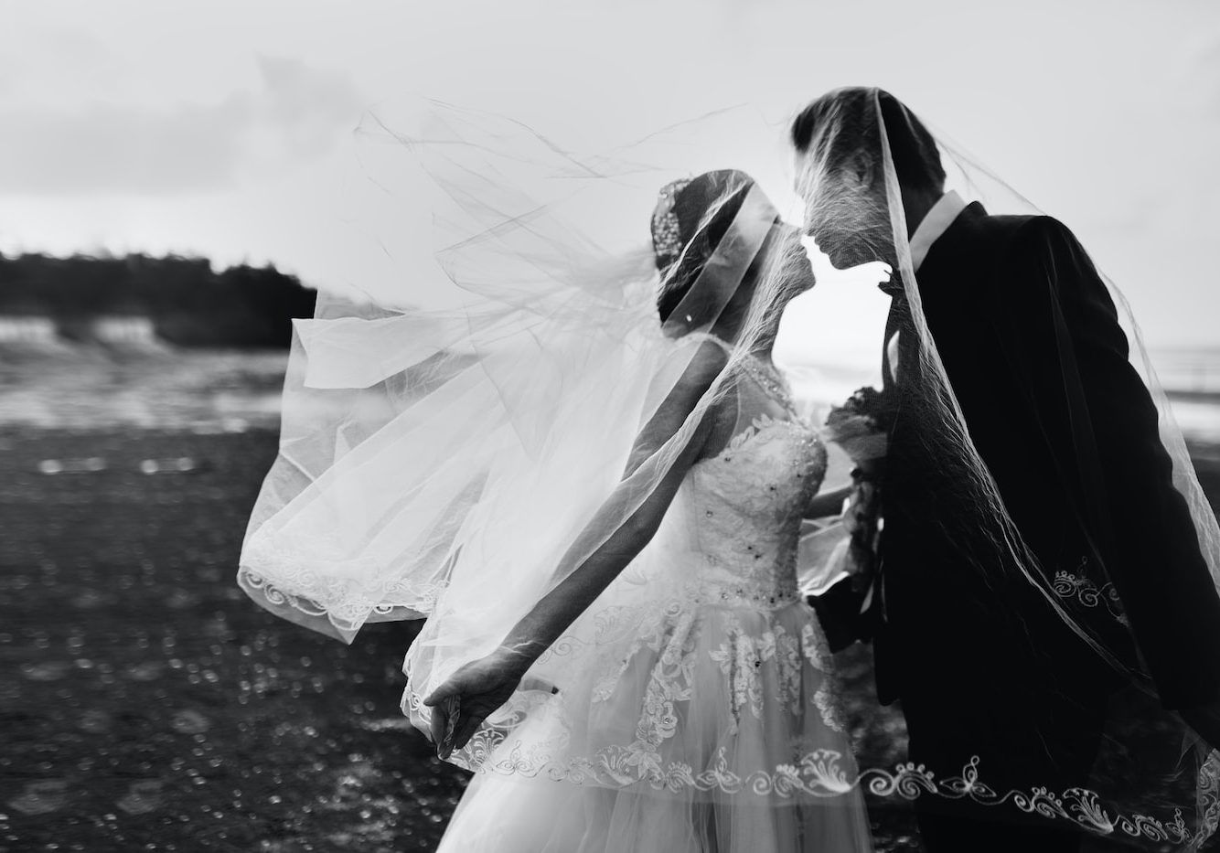 grayscale shot of bride and groom